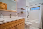 Soak Up the Steam and Unwind After a Day Out in SoHa in the Second Upper Level Bathroom